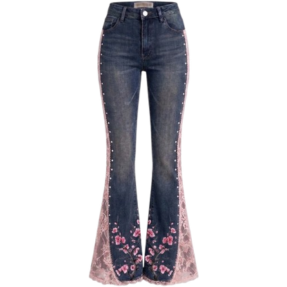 Dark blue denim flare jeans with pink floral lace inserts and silver stud embellishments down the sides.